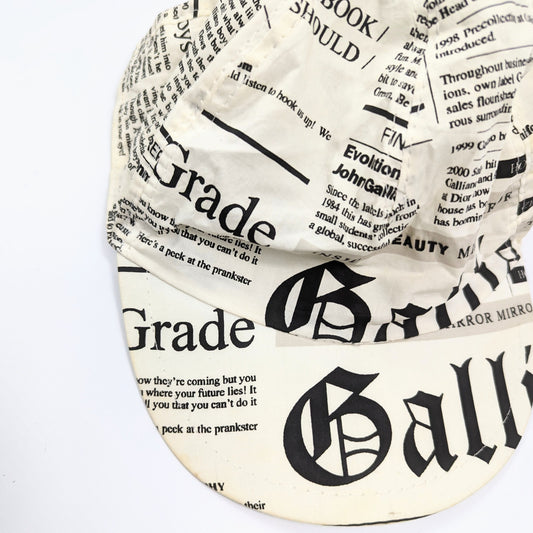 Galliano newspaper pattern cap