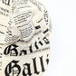 Galliano newspaper pattern cap