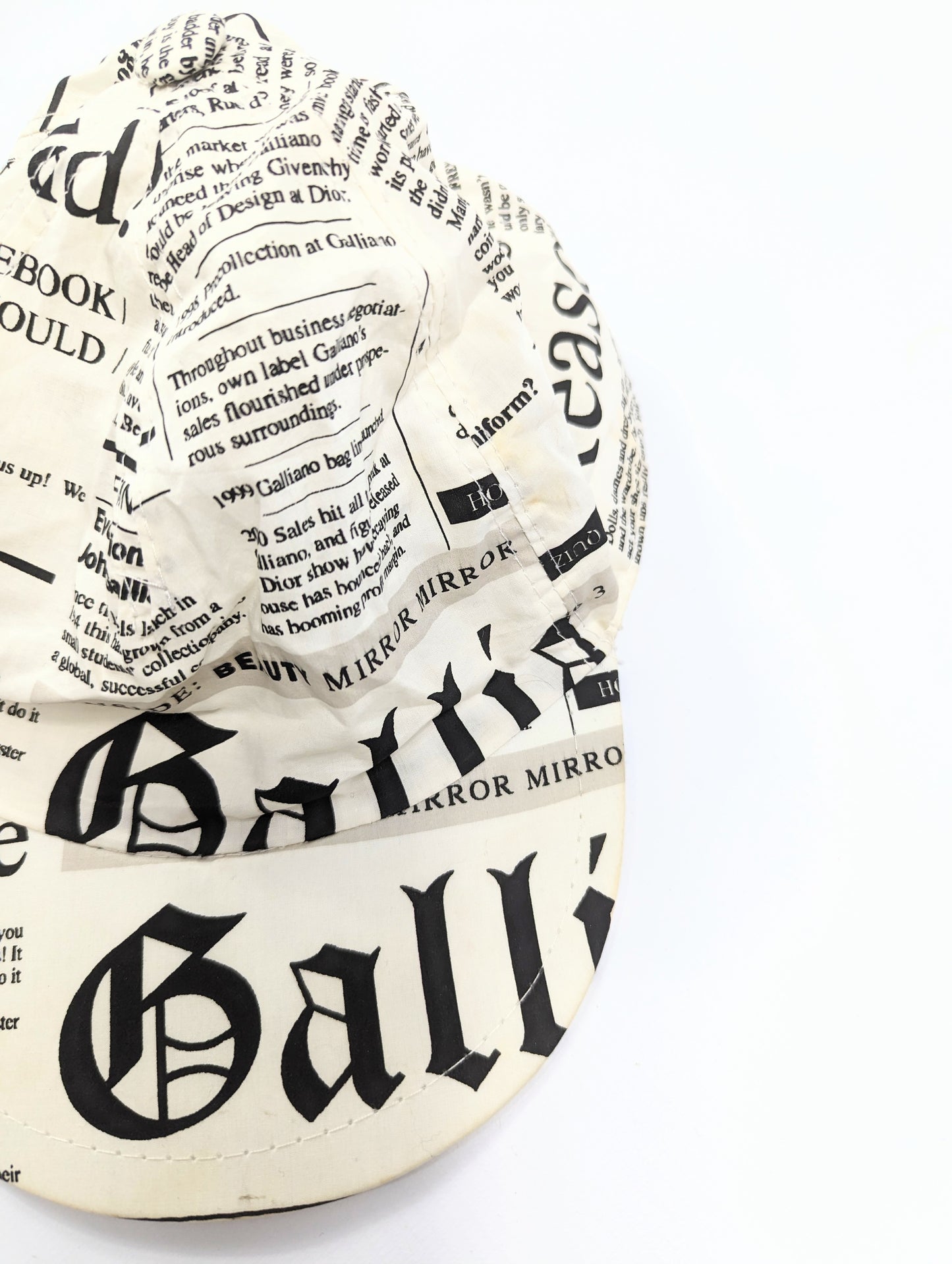 Galliano newspaper pattern cap