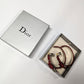 Dior earring by Galliano in burgundy leather