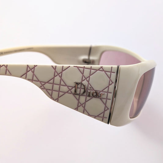 Pink and white Christian Dior sunglasses.