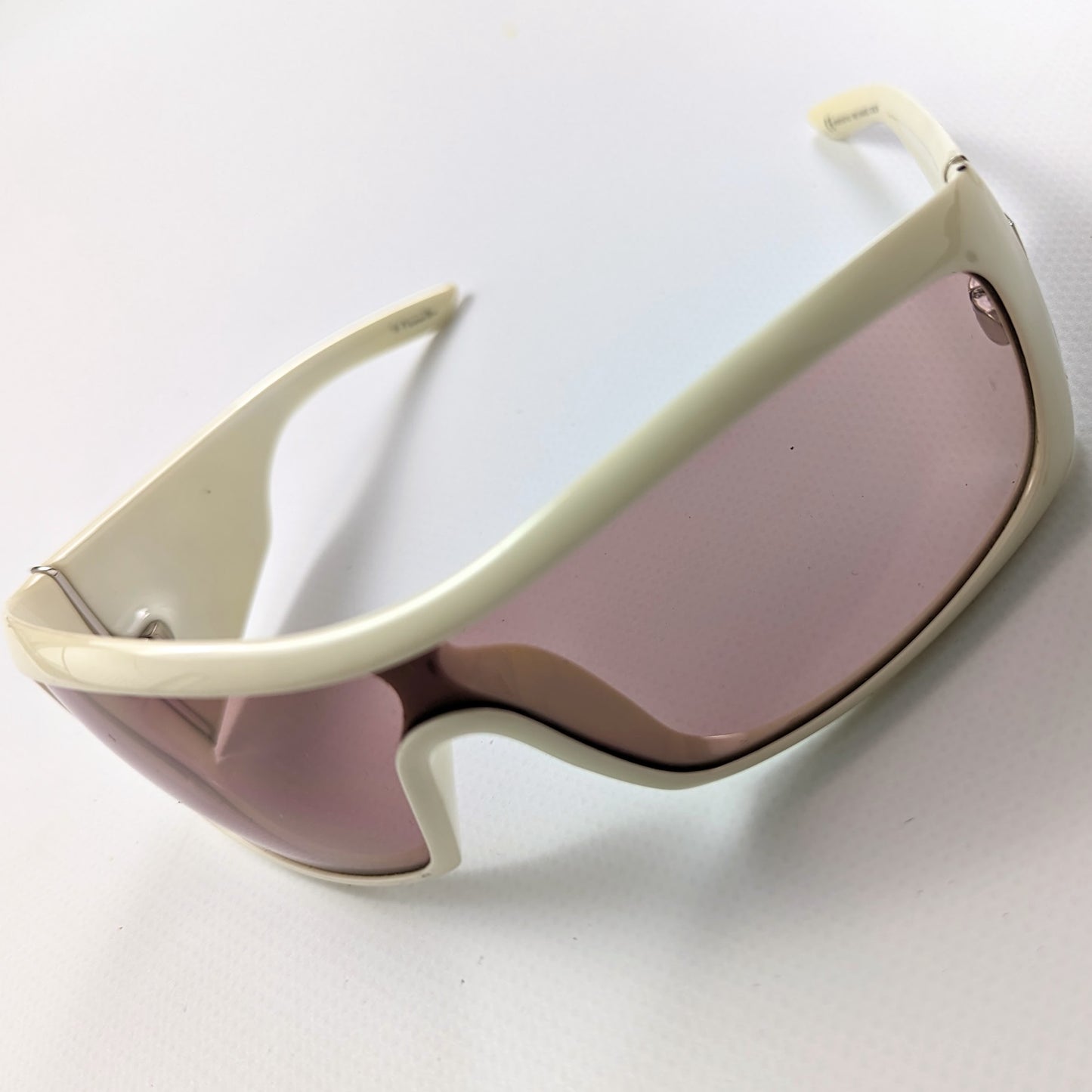 Pink and white Christian Dior sunglasses.